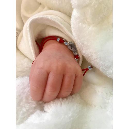 Braccialetto in filo rosso e elemento in argento Baby step 